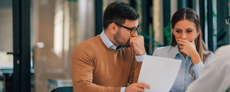 man and woman reviewing mca contract