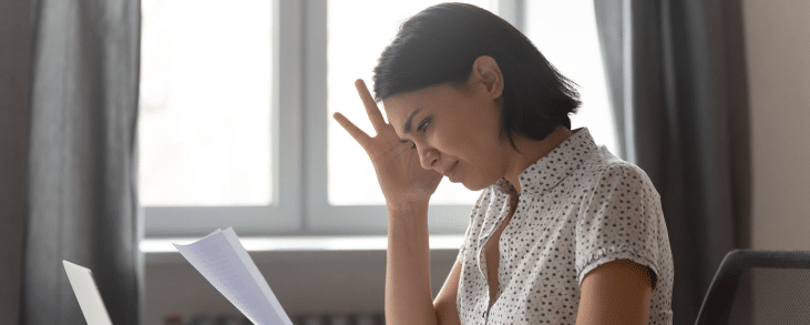 woman looking at bill for fair debt collection practices act